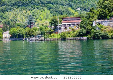 Lake Como, Italy - June 15, 2012: Summer Lake Shore View From Ship Board. Comacina Island
