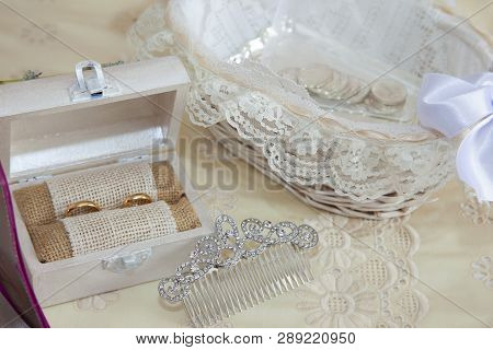 Still Life On The Double Bed Of The Accessories Of A Bride With Arras, A Wooden Box With The Wedding