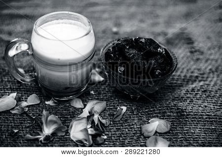 Close Up Of Dates And Raw Milk In A Glass On Gunny Bag Used To Make Date Milk Or Dry Fruit Milk.