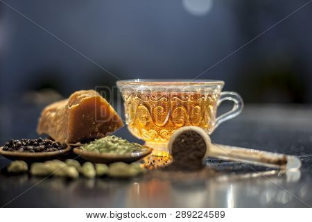 Close Up Of Popular Type Of Tea On Wooden Surface Earlier Dunked A Lot I.e. Jaggery Tea With Ingredi