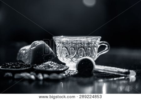 Close Up Of Popular Type Of Tea On Wooden Surface Earlier Dunked A Lot I.e. Jaggery Tea With Ingredi