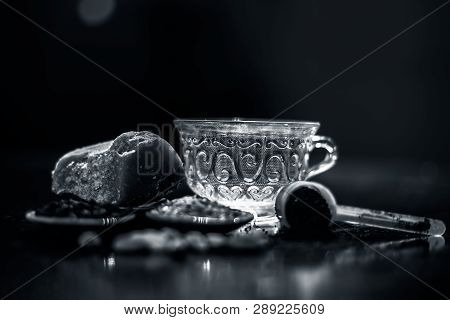 Close Up Of Popular Type Of Tea On Wooden Surface Earlier Dunked A Lot I.e. Jaggery Tea With Ingredi