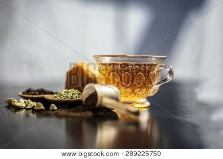 Close Up Of Popular Type Of Tea On Wooden Surface Earlier Dunked A Lot I.e. Jaggery Tea With Ingredi