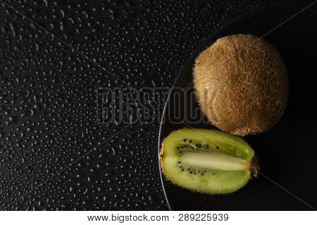 Kiwi Fruit Isolated On Black Background, Fresh Kiwi Fruit. Summer Vitamine Fruit. Healthy Food Or De