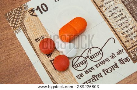 Concept Of The Affordable Medicine In India Due To Generic Drugs On Indian Currency Notes As Backgro