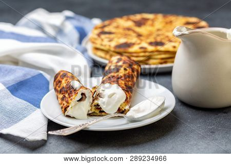 Homemade Potato Pancakes Lefse With Sour Cream.