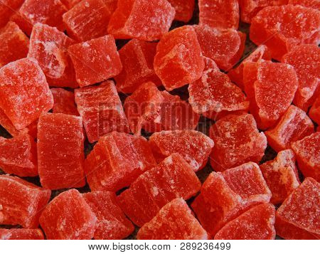 A Bunch Of Red Candied Fruits. Background Gray Loft.