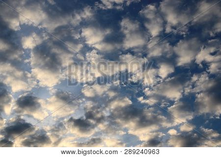 Beautiful Alto Cumulus Cloud Formations On A Deep Blue Sky