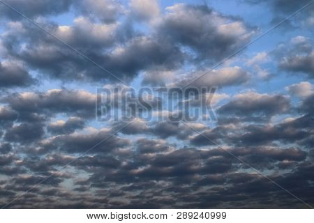 Beautiful Alto Cumulus Cloud Formations On A Deep Blue Sky