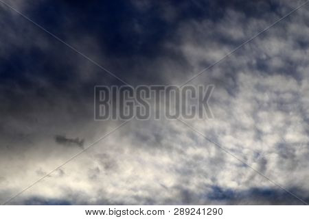 Beautiful Alto Cumulus Cloud Formations On A Deep Blue Sky