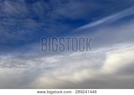Beautiful Alto Cumulus Cloud Formations On A Deep Blue Sky