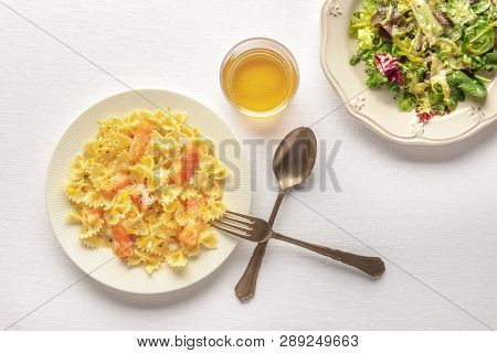Pasta And Wine, Italian Meal. Farfalle With Salmon And Cream Sauce, Shot From Above With A Glass Of 