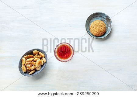 A Glass Of Sweet Wine With Cookies And Nuts, Shot From The Top With A Place For Text