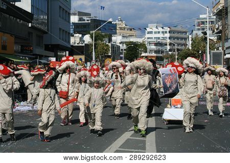 Limassol, Cyprus, March 10th, 2019: Group Of People In Mushroom Costumes Walking Along Archbishop Ma