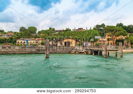 Small Wooden Pier City Of Manerba Del Garda Is A Quiet Resort Town On The Western Shore Of Lake Gard