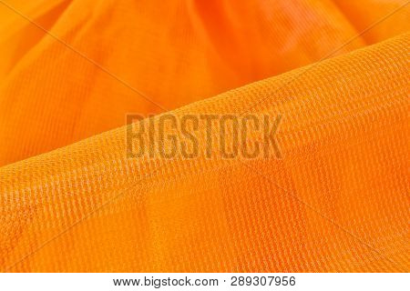 Texture Of Orange Tulle As Background, Closeup