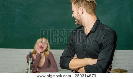 Smart And High Trained. Handsome Man Standing Hands Crossed In Classroom With Teacher. High School S