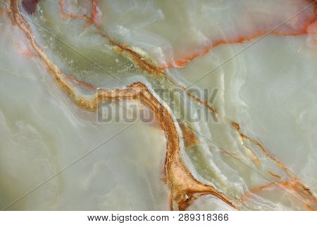 Background From A Pattern Of A Natural Stone Of Green Onyx With Red Streaks