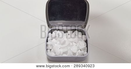 Open Metal Box With White Mint Candy For Fresh Breath Isolated On White Background