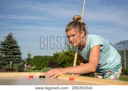 Women Playing Novuss In Outdoors. Novuss Is A National Sport In Latvia Similar To Pocket Billiards O