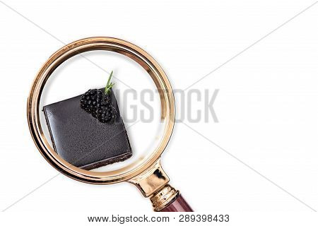 Cake In The Magnifying Glass. Food Composition Analysis Concept.