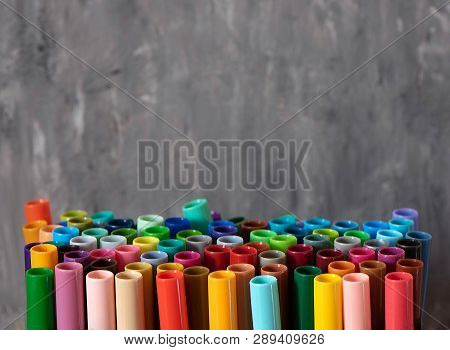 A Set Of Colorful Markers, With A Place For Copy Space On Grey Background