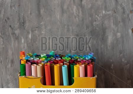 A Set Of Colorful Markers, With A Place For Copy Space On Grey Background