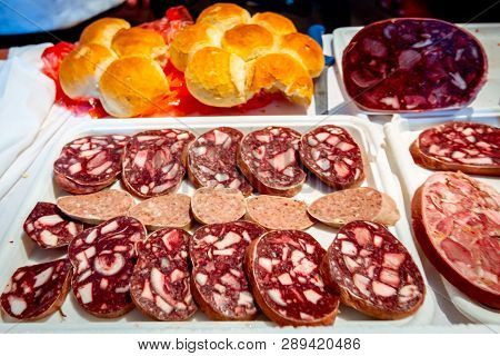 Chopped Headcheese, Dry White Sausage And Bread For Sale Are Placed Outdoor At Flea Market.