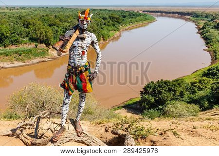 Omo Valley, Korcho Village, Ethiopia - December 09, 2013: Unidentified Karo Man With A Gun And With 