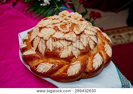 Traditional Slavic Wedding Loaf With Salt Lying On A Rushnik.