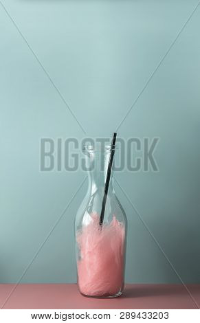 Glass On The Table With Abstract Drink Against The Background Of The Blue Wall. Blank Empty Text Spa