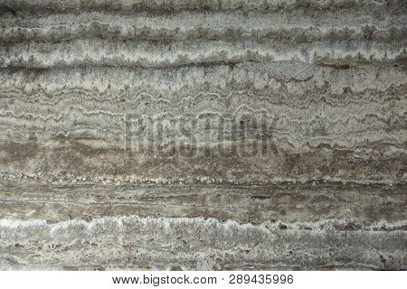 Natural Stone Travertine Gray-beige And Parallel Stripes Is Called Travertino Titanium