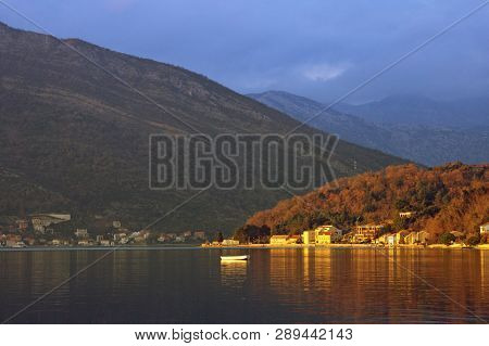 Beautiful Mediterranean Landscape. Small Seaside Village Lit By The Setting Sun. Montenegro, Adriati