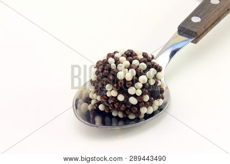 Brigadeiro (brigadier), Chocolate Sweet Typical Of Brazilian Cuisine Covered With Particles, In A Wh