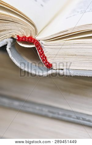 Opened Old Book In A Bright Cover Lies On The Table Close-up Design Blank For The Project