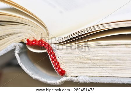Opened Old Book In A Bright Cover Lies On The Table Close-up Design Blank For The Project