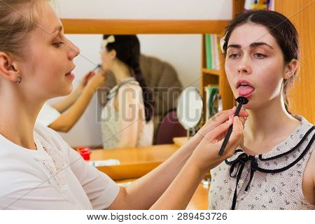 The Speech Therapist Makes A Tongue Massage To The Patient By A Special Probe.