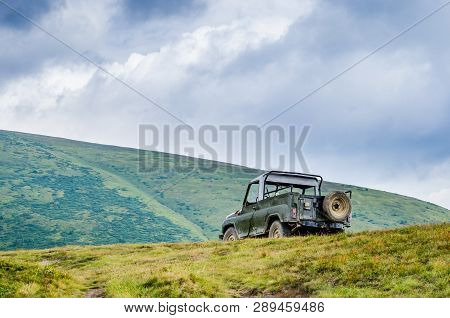 Old Car In The Mountains Of The Carpathians Is On A Hill