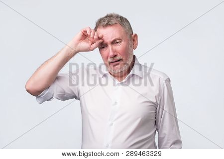 Sad Senior Man In White Shirt Thinking Abour Life.
