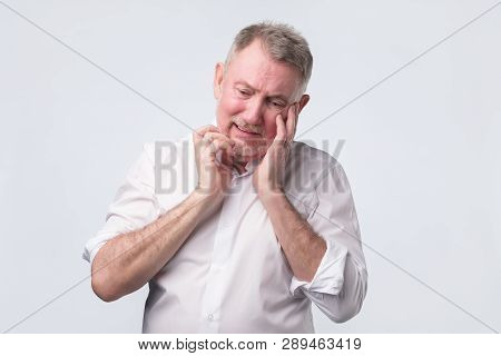 Sad Senior Man In White Shirt Thinking Abour Life.