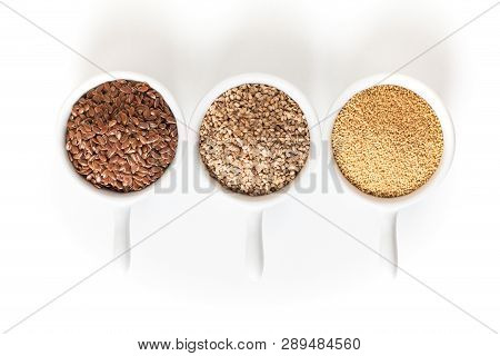 Healthy Food Ingredents 3 Kind Of Gluten Free Grains Flax, Amaranth And Sesame Seeds On White Backgr