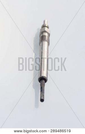 Candle In A Diesel Engine. On A White Background. Do Not Isolate The Red Tip.