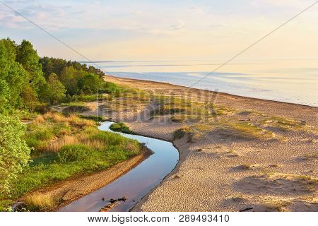Sunset At The Beach Saulkrasti Located Near The Latvian Capital Riga. The View Of The Rigas Bay.