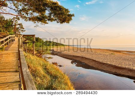 Sunset At The Beach Saulkrasti, Located Near The Latvian Capital Riga. The View Of The Rigas Bay.