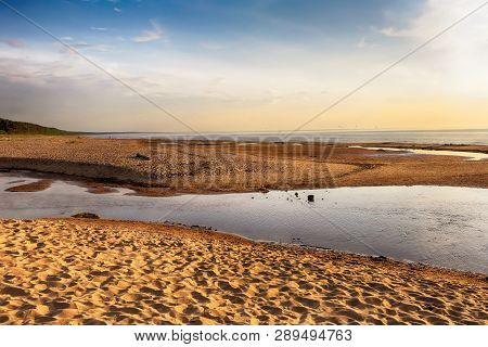 Sunset At The Beach Saulkrasti Located Near The Latvian Capital Riga. The View Of The Rigas Bay.