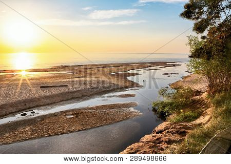 Sunset At The Beach Saulkrasti, Located Near The Latvian Capital Riga. The View Of The Rigas Bay.