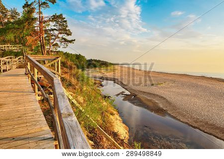 Sunset At The Beach Saulkrasti, Located Near The Latvian Capital Riga. The View Of The Rigas Bay.