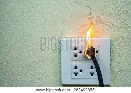 On Fire Electric Wire Plug Receptacle Wall Partition,electric Short Circuit Failure Resulting In Ele