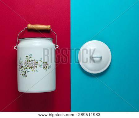 Enamelled Milk Can On Blue-red Background Top View