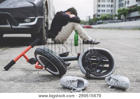 Image Of Shocked And Scared Driver After Accident Involved Kid's Bike And Helmet Lying On The Road O